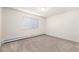 Bright bedroom featuring neutral carpeting and a window, offering ample natural light and a calming retreat at 350 S Clinton St # 2A, Denver, CO 80247