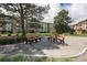 Inviting community space featuring benches and mature trees near the residential building at 350 S Clinton St # 2A, Denver, CO 80247