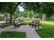 Serene common area featuring benches surrounded by lush greenery, providing a peaceful outdoor space for relaxation and enjoyment at 350 S Clinton St # 2A, Denver, CO 80247