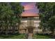 Charming condo building at 350 S Clinton St with manicured front lawn and mature shade trees at 350 S Clinton St # 2A, Denver, CO 80247
