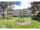 Manicured lawn and flower garden surrounding the residential building at 350 S Clinton St # 2A, Denver, CO 80247