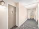 Well-maintained hallway with neutral walls, patterned carpet, and easy access to unit 2-A at 350 S Clinton St # 2A, Denver, CO 80247