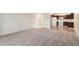 Spacious living room with plush carpeting and access to kitchen, perfect for entertaining at 350 S Clinton St # 2A, Denver, CO 80247