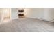 Open living space with neutral carpeting and views of the kitchen, great for modern living at 350 S Clinton St # 2A, Denver, CO 80247