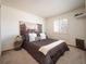 A well-lit room with a comfortable bed, stylish decor, and shuttered windows at 11302 W Prentice Dr, Littleton, CO 80127