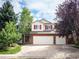 Charming two-story home with a three-car garage and well-maintained front yard at 11302 W Prentice Dr, Littleton, CO 80127