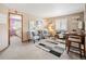 Inviting sitting room with neutral tones, stylish seating, and a glimpse into an adjacent bedroom at 11302 W Prentice Dr, Littleton, CO 80127