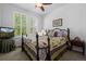Cozy bedroom featuring ample natural light from the window and a comfortable bed at 3748 Starry Night Loop, Castle Rock, CO 80109