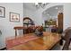 Dining room with wood table, chairs and decorative table runner at 3748 Starry Night Loop, Castle Rock, CO 80109