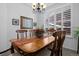 Bright dining room features a chandelier and window with white shutters at 3748 Starry Night Loop, Castle Rock, CO 80109
