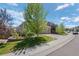Well-kept lawn and landscaping surround this lovely home with an attached three-car garage at 3748 Starry Night Loop, Castle Rock, CO 80109