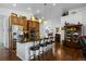 Stylish kitchen island with granite countertop, pendant lighting, barstool seating, and stainless steel appliances at 3748 Starry Night Loop, Castle Rock, CO 80109