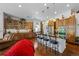 Open kitchen features a granite-topped island, breakfast bar seating, wood cabinetry, and stainless steel appliances at 3748 Starry Night Loop, Castle Rock, CO 80109