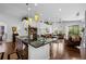 Kitchen island provides seating and food-prep space, open to the living area and backyard at 3748 Starry Night Loop, Castle Rock, CO 80109