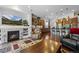 Open floor plan, living room featuring hardwood floors and a fireplace, perfect for entertaining at 3748 Starry Night Loop, Castle Rock, CO 80109