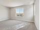Bedroom featuring neutral carpet and neighborhood views at 1839 Morgan Dr, Erie, CO 80516
