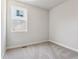 Cozy bedroom with neutral carpet and a bright window at 1839 Morgan Dr, Erie, CO 80516