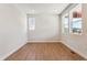 Bright room with hardwood floors and ample natural light from large windows at 1839 Morgan Dr, Erie, CO 80516