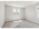 Bright bedroom with carpet and two windows at 1839 Morgan Dr, Erie, CO 80516