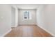 Bright bedroom with hardwood floors and neutral paint at 1839 Morgan Dr, Erie, CO 80516
