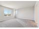 Bright bedroom featuring neutral carpet and natural lighting at 1839 Morgan Dr, Erie, CO 80516