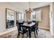 Elegant dining room with modern chandelier, a large window, and seating for six at 1839 Morgan Dr, Erie, CO 80516