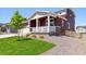 Well-maintained home with a covered porch, lovely landscaping, and inviting curb appeal at 1839 Morgan Dr, Erie, CO 80516