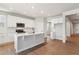 Modern kitchen features white cabinets, stainless steel appliances, and center island at 1839 Morgan Dr, Erie, CO 80516