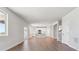 Open-concept living area with wood floors connecting to the modern kitchen at 1839 Morgan Dr, Erie, CO 80516