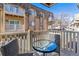 View from balcony showing table and chairs with apartment building at 7375 E Quincy Ave # 202, Denver, CO 80237