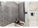 Stylish bathroom showcasing subway tile in shower and modern tub at 7375 E Quincy Ave # 202, Denver, CO 80237