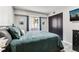 Comfortable bedroom with a plush bed, natural light, and closet at 7375 E Quincy Ave # 202, Denver, CO 80237