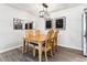 Dining area features a wooden table, seating for four, modern lighting, and contemporary decor at 7375 E Quincy Ave # 202, Denver, CO 80237