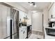 Bright kitchen features stainless steel appliances, white cabinetry, and updated fixtures at 7375 E Quincy Ave # 202, Denver, CO 80237