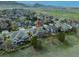Aerial view of the neighborhood, showcasing the house with mountain views at 9362 S Holland Way, Littleton, CO 80127