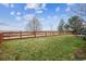 Spacious, well-maintained backyard with a wood fence offering privacy and scenic views at 9362 S Holland Way, Littleton, CO 80127