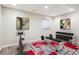 Home gym features a patterned rug and exercise equipment at 9362 S Holland Way, Littleton, CO 80127