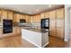 Well-equipped kitchen with granite counters, ample cabinet space, and hardwood floors at 9362 S Holland Way, Littleton, CO 80127