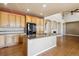 Updated kitchen with granite counters, stainless appliances, and hardwood floors at 9362 S Holland Way, Littleton, CO 80127