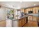 Spacious kitchen features a center island, hardwood floors, and modern appliances at 9362 S Holland Way, Littleton, CO 80127