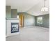 Cozy living room featuring a fireplace, and natural light from the window at 9362 S Holland Way, Littleton, CO 80127