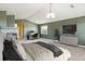 Large main bedroom featuring vaulted ceiling, an office space, and neutral decor at 9362 S Holland Way, Littleton, CO 80127
