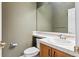 Cozy half bathroom with a vanity, mirror, and neutral wall color at 9362 S Holland Way, Littleton, CO 80127