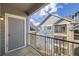 View from the balcony of a blue apartment building with a black metal railing at 4451 S Ammons St # 1-304, Littleton, CO 80123
