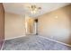 Bedroom features neutral color walls, carpeted floors and open doorway at 4451 S Ammons St # 1-304, Littleton, CO 80123