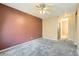 Spacious bedroom with neutral color walls and carpeted floors at 4451 S Ammons St # 1-304, Littleton, CO 80123