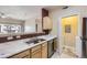 Well lit kitchen features stainless steel appliances, marble countertops, and hardwood flooring at 4451 S Ammons St # 1-304, Littleton, CO 80123