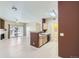 Open concept living space flows from living room to kitchen, with balcony access and laundry at 4451 S Ammons St # 1-304, Littleton, CO 80123