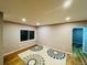 Living room with hardwood floors and large window at 4790 Saint Paul St, Denver, CO 80216