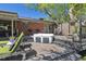 Outdoor deck featuring a hot tub and lounge chairs for relaxing in the backyard at 1196 S Quebec Way, Denver, CO 80231